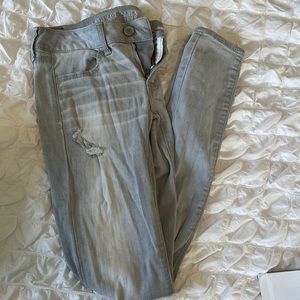 Grey ripped american eagle jeans